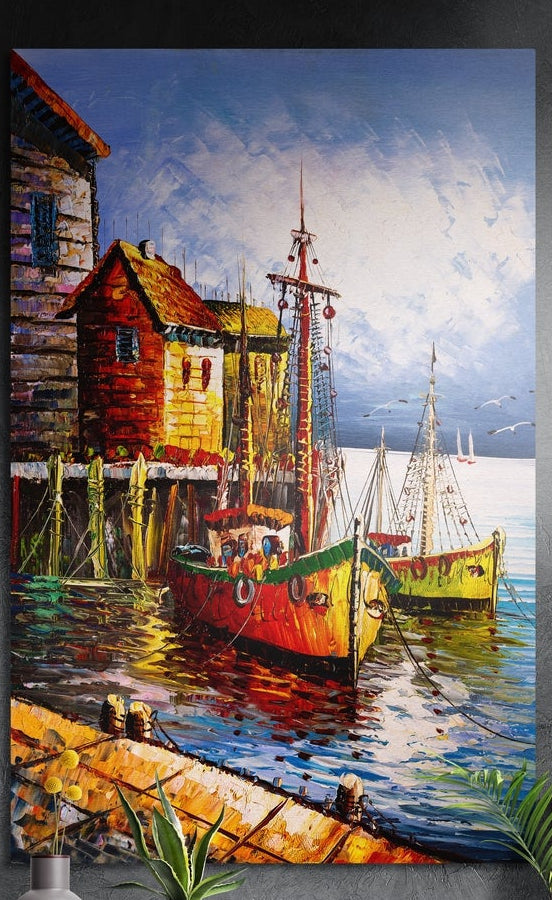 Harbor fishing boats brushed aluminum wall art with a red pier hut on a dark wall above a lamp and potted plants
