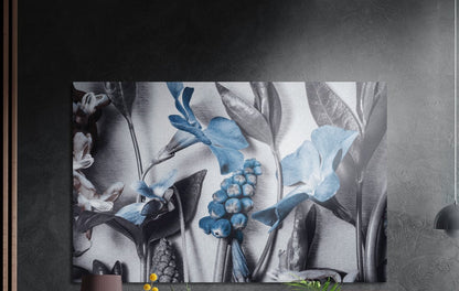 Steel blue blooms among gray foliage, brushed aluminum wall art on a dark gray wall beside a black wall lamp