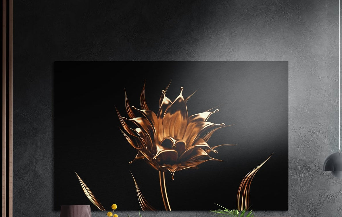 Golden flower on a black background, brushed aluminum wall art on a dark gray wall beside a black wall lamp