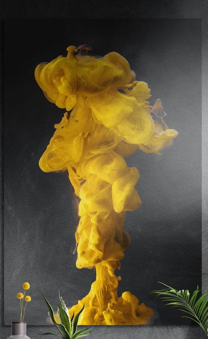 Yellow ink cloud burst brushed aluminum wall art on a dark textured wall behind a vase and potted plants