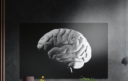 White halftone brain on a black background, brushed aluminum wall art on a dark gray wall above a sideboard