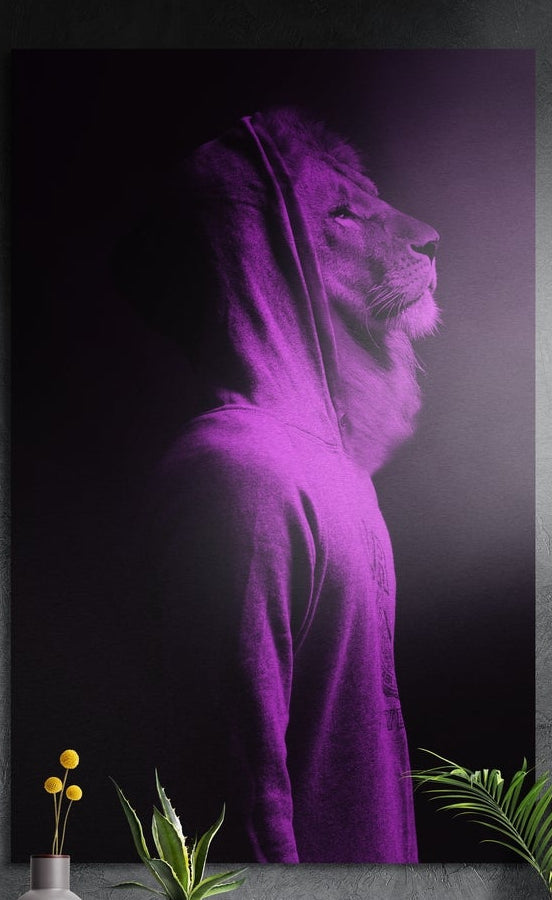 Lion in a purple hoodie in profile, brushed aluminum wall art on a gray wall above a vase and plants