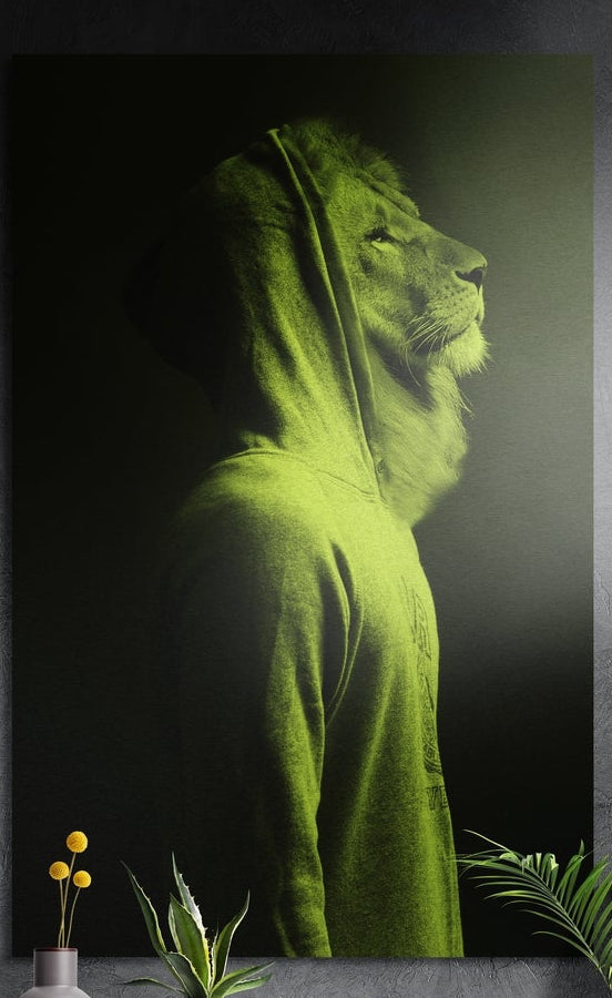 Lion in profile wearing a lime green hoodie with the hood up, brushed aluminum wall art on a dark wall