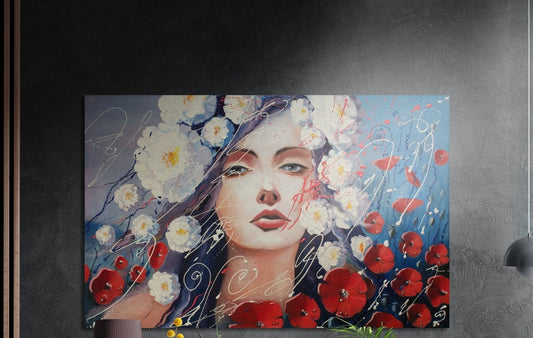 Woman with red poppies and white blossoms brushed aluminum wall art on a dark wall above a lamp and yellow flowers