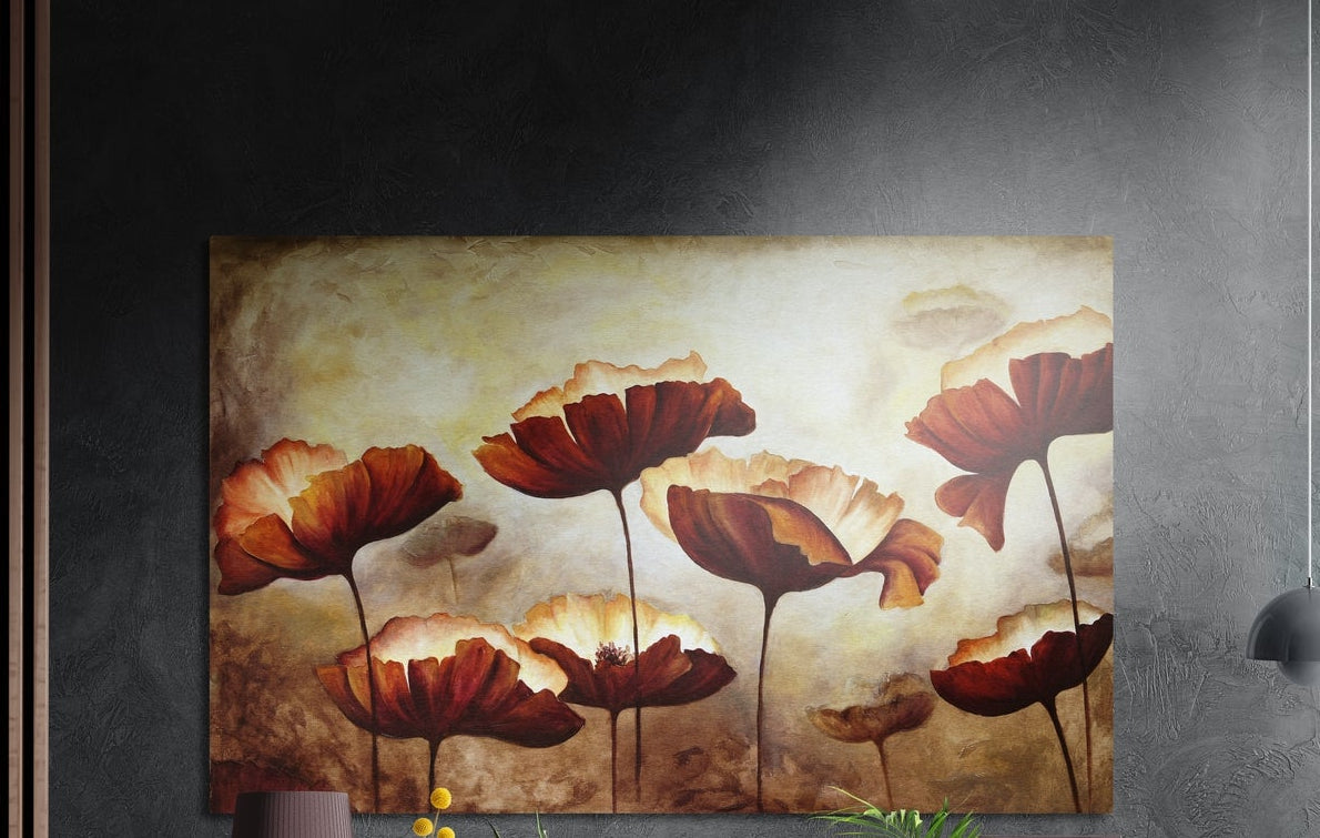Red poppies on amber brushed aluminum wall art on a dark textured wall above a vase and plants