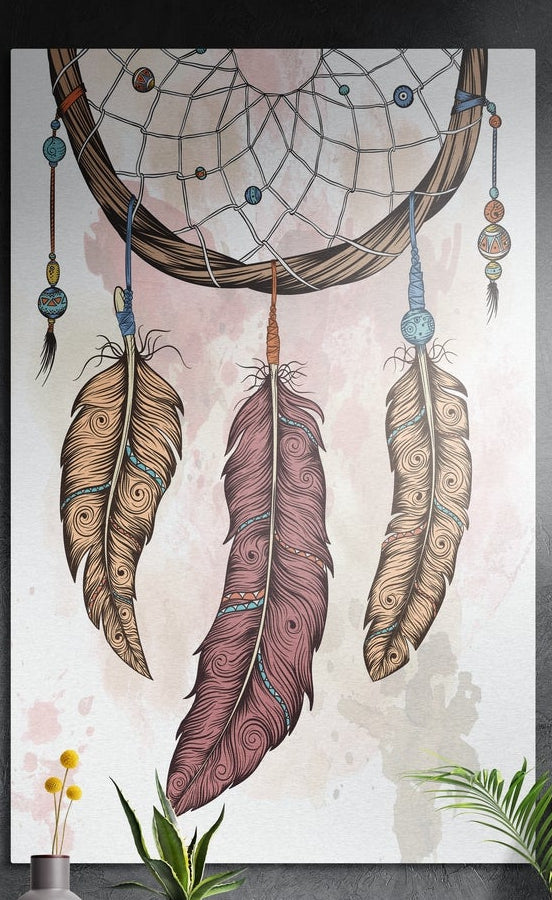 Blush pink feather dreamcatcher brushed aluminum wall art on a dark textured wall above potted plants