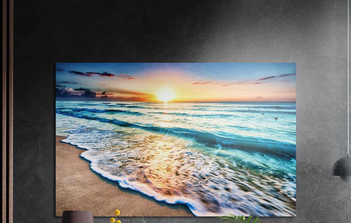 Turquoise waves beach sunset brushed aluminum wall art on a dark textured wall