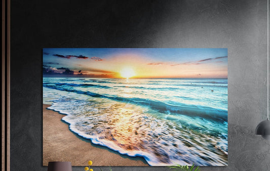 Turquoise waves beach sunset brushed aluminum wall art on a dark textured wall
