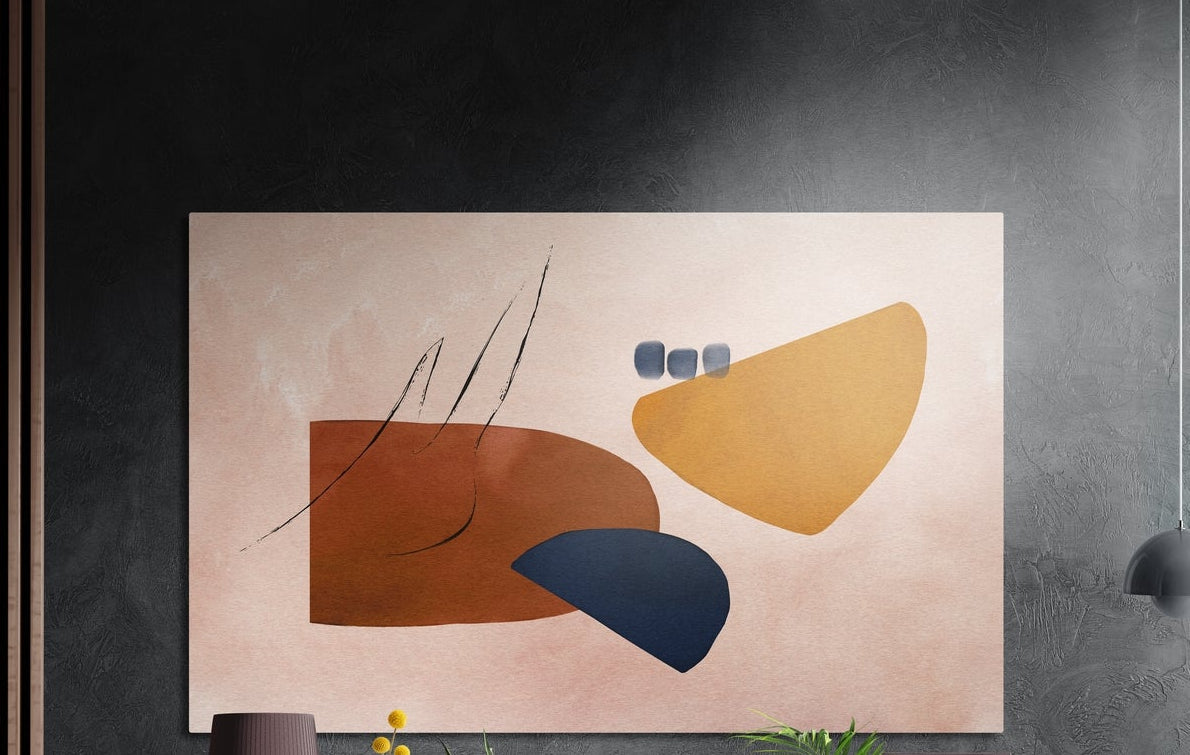 Terracotta, mustard and navy organic shapes on blush, brushed aluminum wall art on a dark textured wall