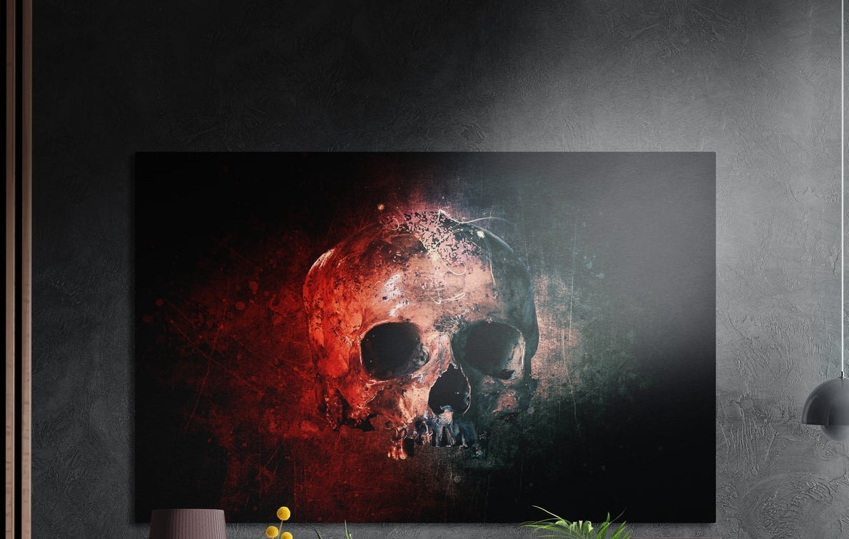 Red and teal grunge skull brushed aluminum wall art on a gray concrete wall with a lamp and plants below
