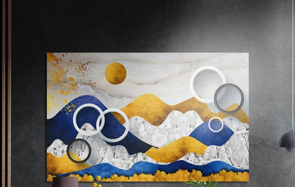 Blue and gold mountains brushed aluminum wall art on a dark gray wall above a sideboard with a vase and plants