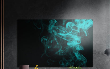 Turquoise smoke swirl brushed aluminum wall art on a dark textured wall with plants below