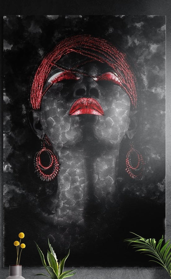 Red headwrap woman on dark smoke brushed aluminum wall art on a dark textured wall above yellow flowers and plants