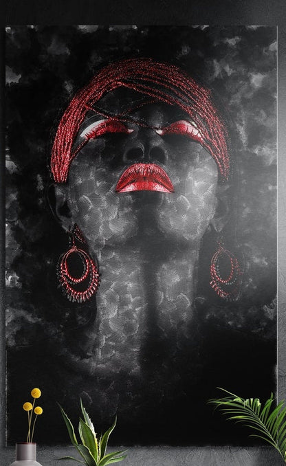 Red headwrap woman on dark smoke brushed aluminum wall art on a dark textured wall above yellow flowers and plants