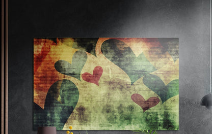 Copper, green and red grunge hearts on a weathered cream ground, brushed aluminum wall art on a dark wall