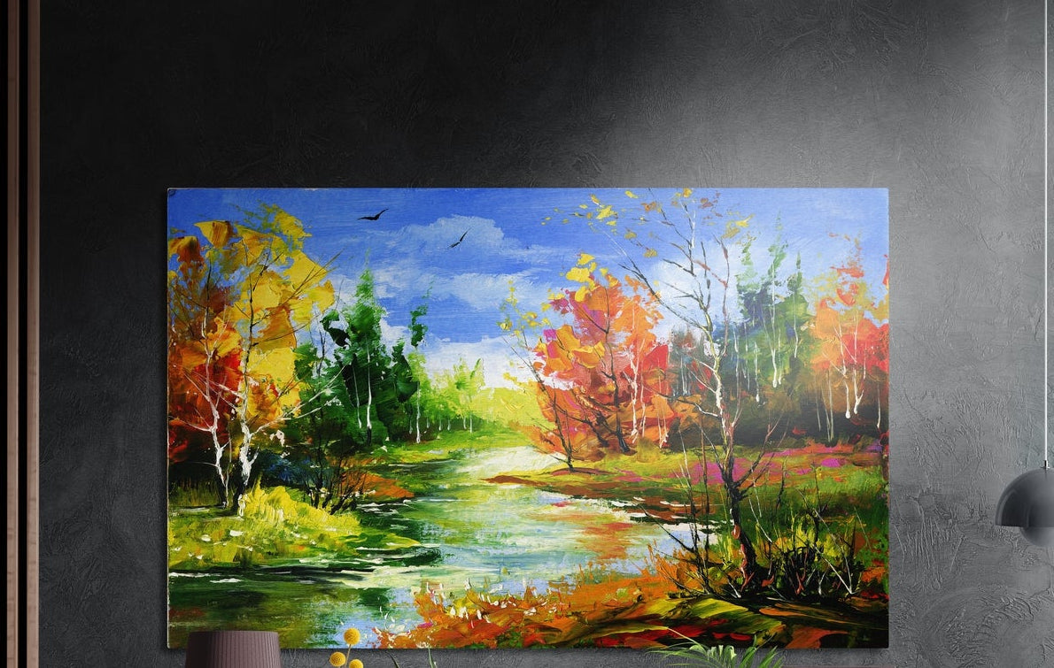 Autumn forest creek brushed aluminum wall art on a dark gray wall above a sideboard with a vase and plants