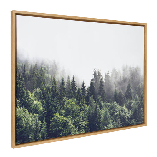 Lush green forest on a foggy day framed canvas wall art
