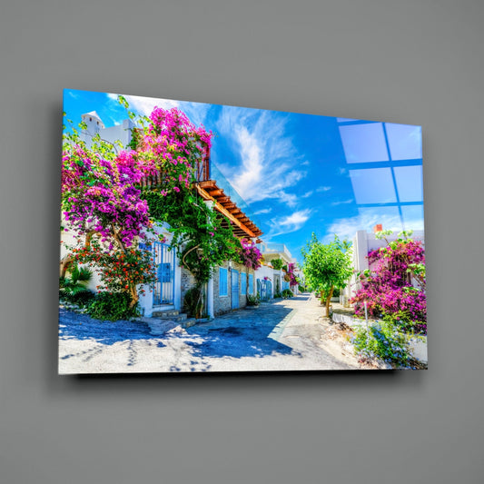 Bougainvillea Aegean lane glass wall art on a gray wall with soft window light