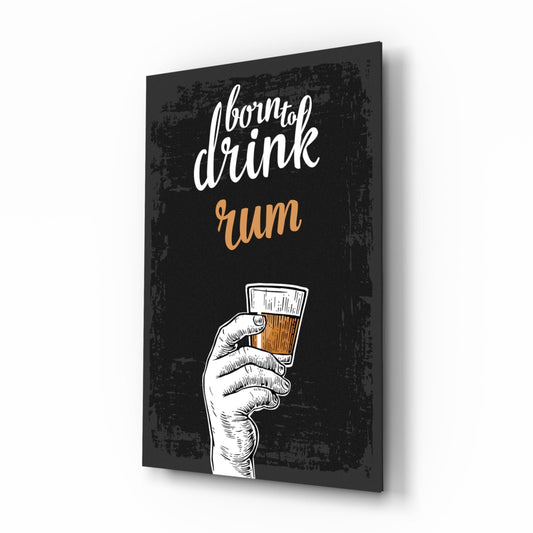 Born to drink rum script above a hand holding a rum glass, tall black glass wall art on a white background