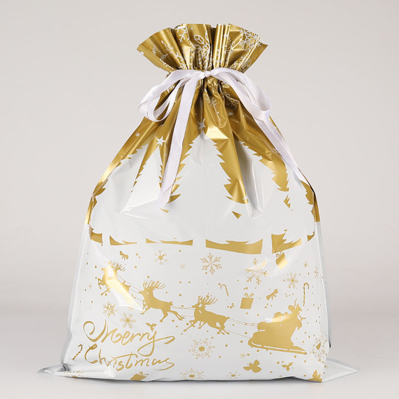 Gift bag with gold Christmas patterns on a light gray background