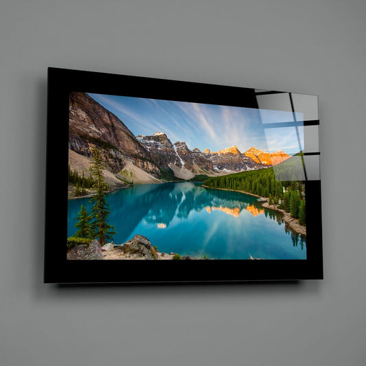 Turquoise mountain lake at golden hour glass wall art on a gray wall