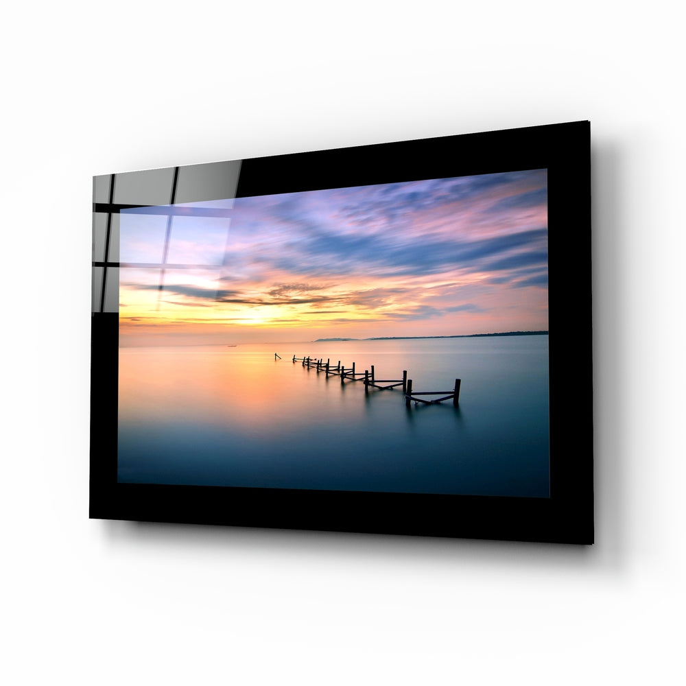 Curving pier sunset glass wall art in blush and cobalt