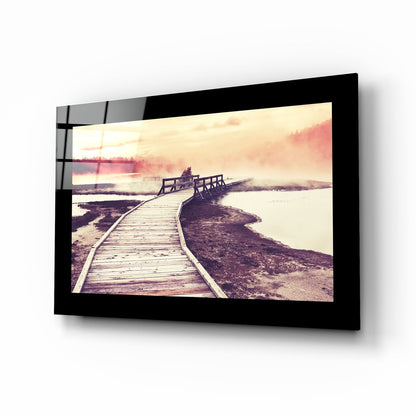 Misty boardwalk sunset glass wall art in rose and amber tones