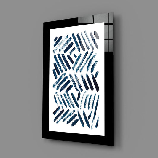 Blue brushstroke herringbone abstract glass wall art angled on a plain gray background
