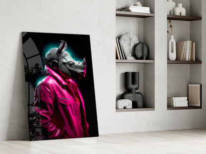 Rhino in pink jacket glass piece leaning against a wall next to white shelves with vases and books