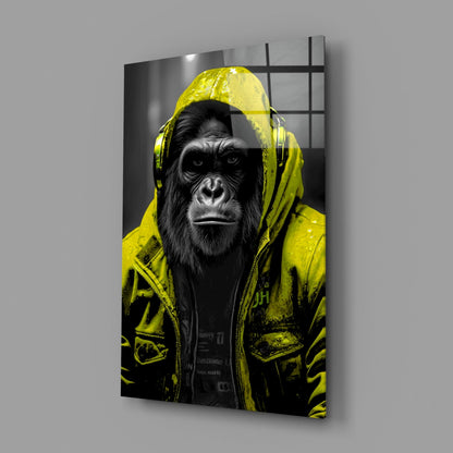 Yellow rain hood gorilla glass wall art on a gray wall with a soft window reflection