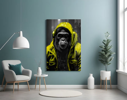Yellow rain hood gorilla glass wall art on a blue-gray wall beside a white armchair and plant