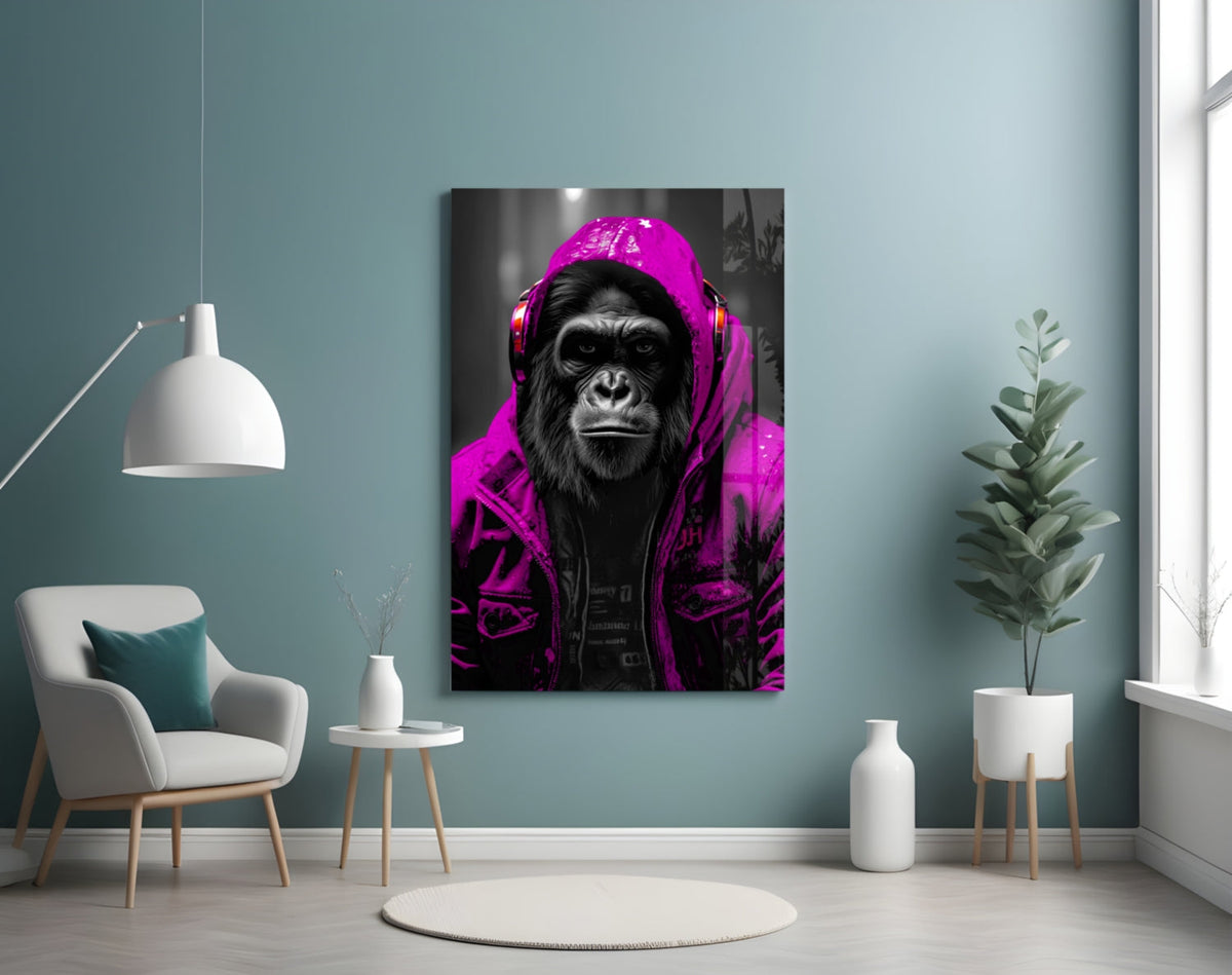 Pink rain hood gorilla glass wall art on a blue-gray wall beside a white armchair and plant