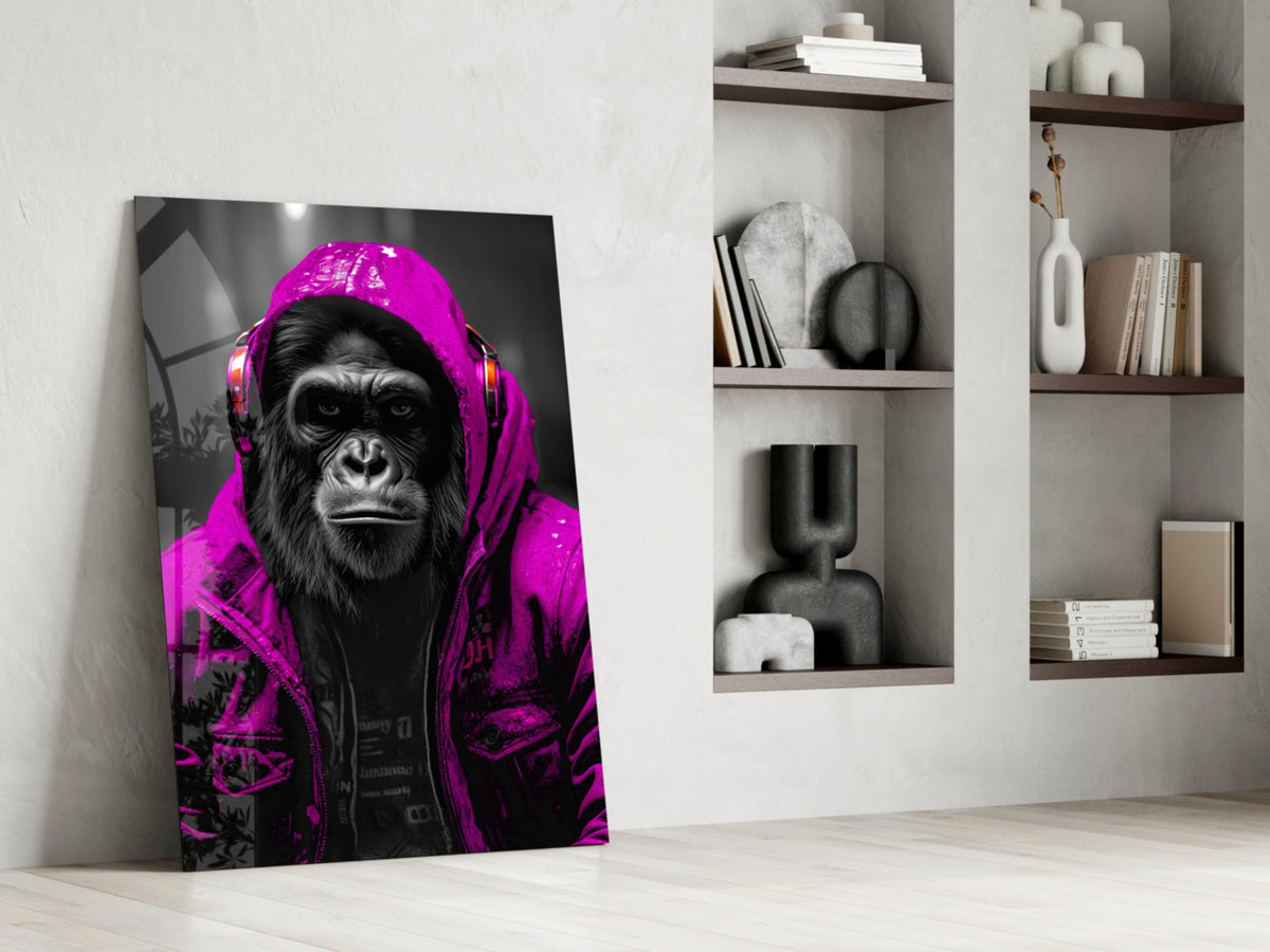 Pink rain hood gorilla glass wall art leaning against a wall next to shelves of vases and books