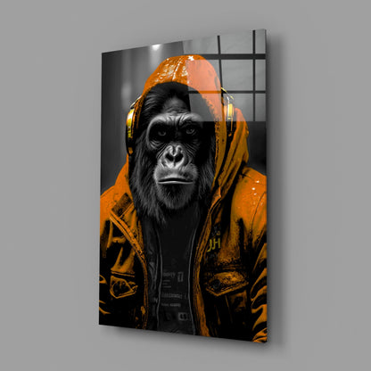 Orange rain hood gorilla glass wall art on a gray wall with a soft window reflection