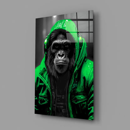 Green rain hood gorilla glass wall art on a gray wall with a soft window reflection
