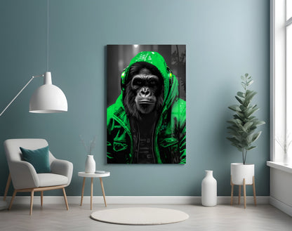 Green rain hood gorilla glass wall art on a blue-gray wall beside a white armchair and plant