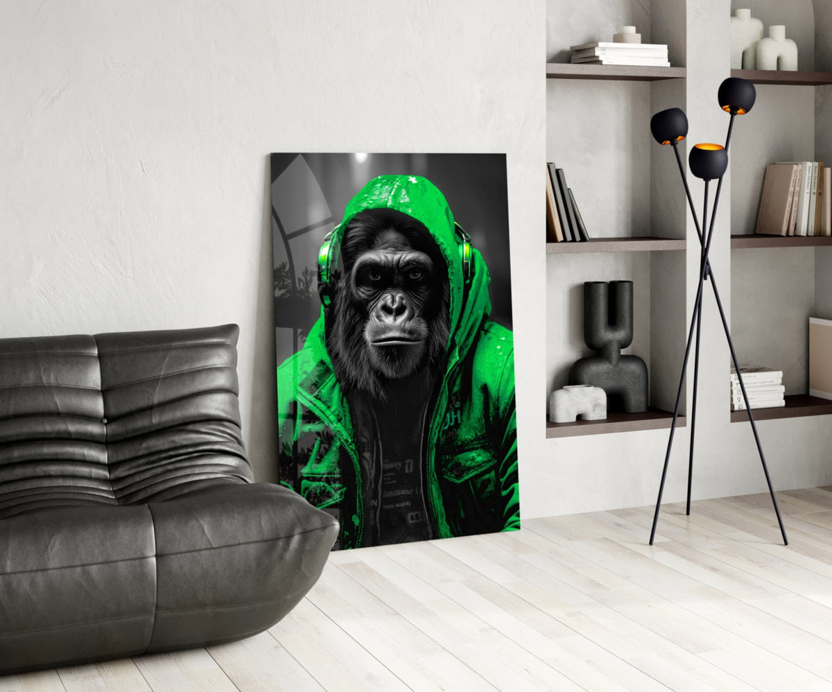 Green rain hood gorilla glass wall art leaning beside a black leather lounge chair and shelves