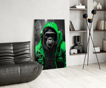 Green rain hood gorilla glass wall art leaning beside a black leather lounge chair and shelves