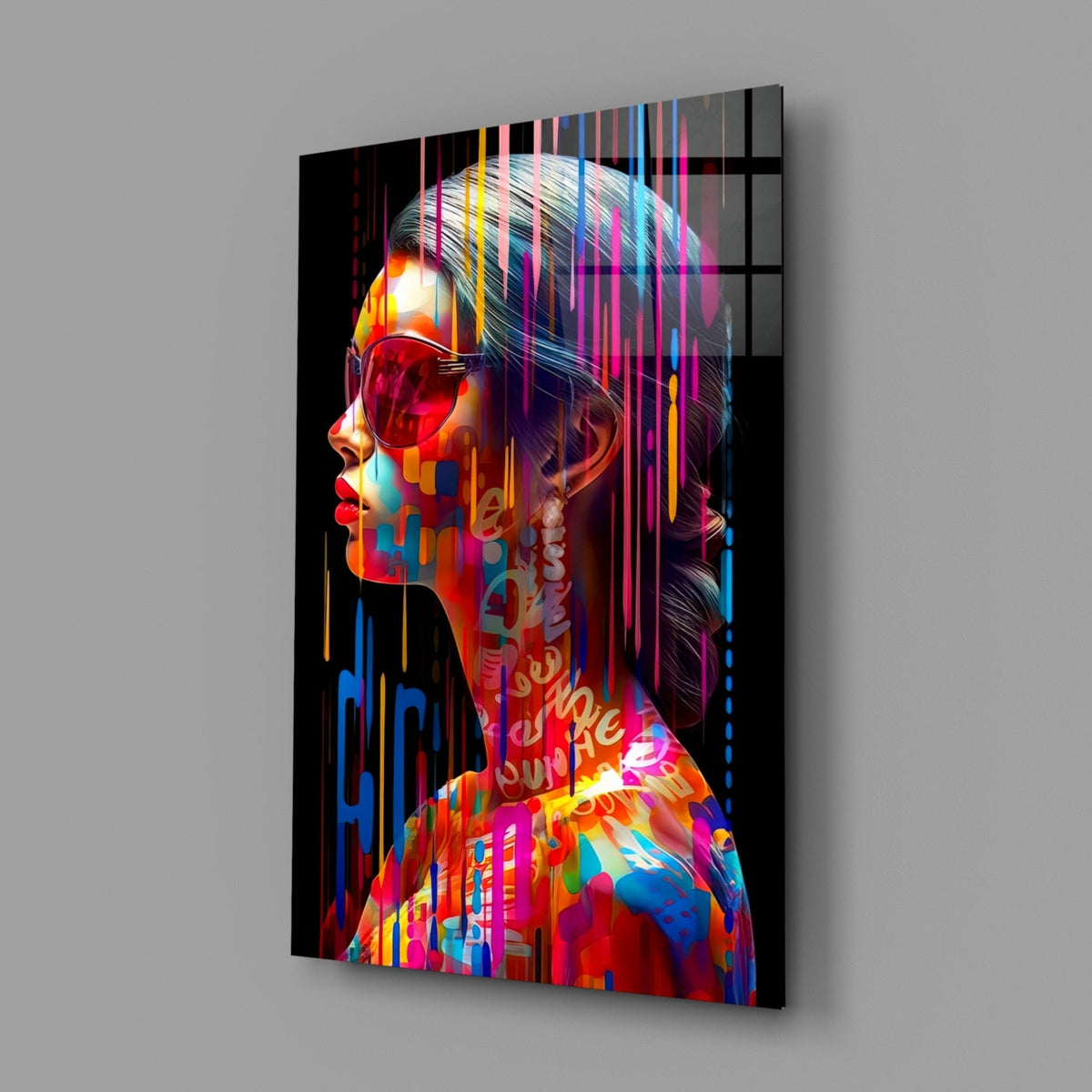 Rainbow drip woman in profile glass wall art on a gray wall, angled view