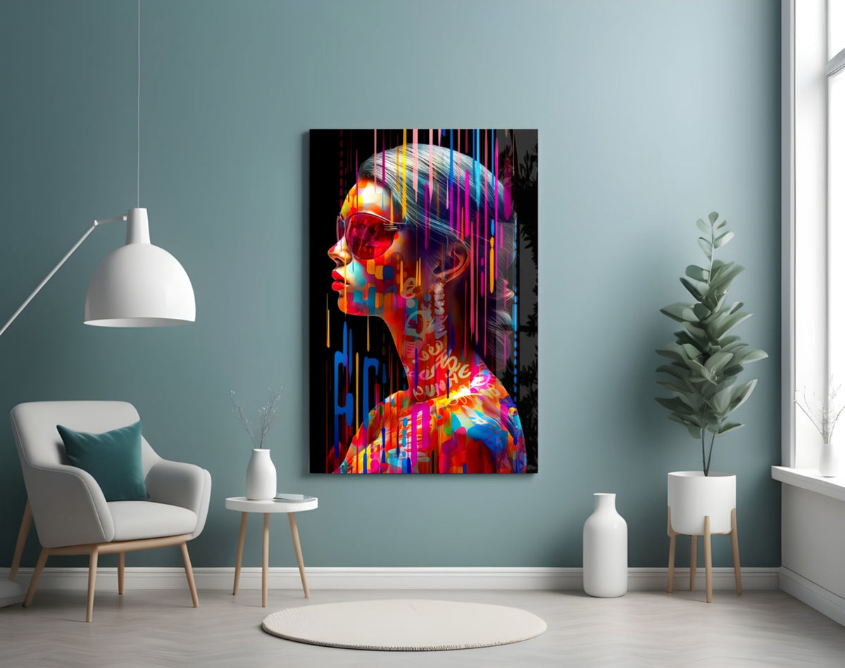 Rainbow drip woman in profile glass wall art on a teal wall above a white armchair and side table