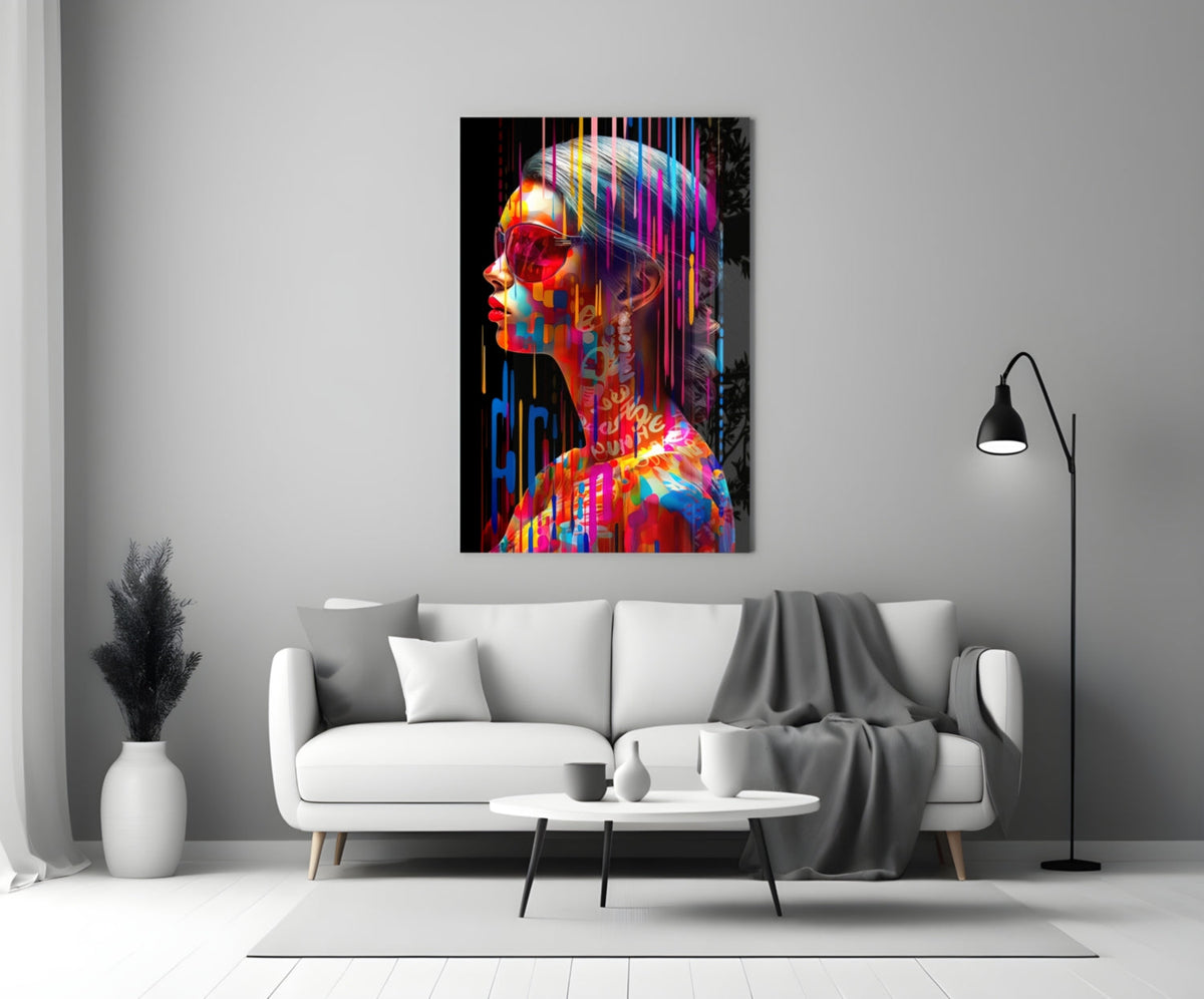 Rainbow drip woman in profile glass wall art above a white sofa and coffee table in a gray living room
