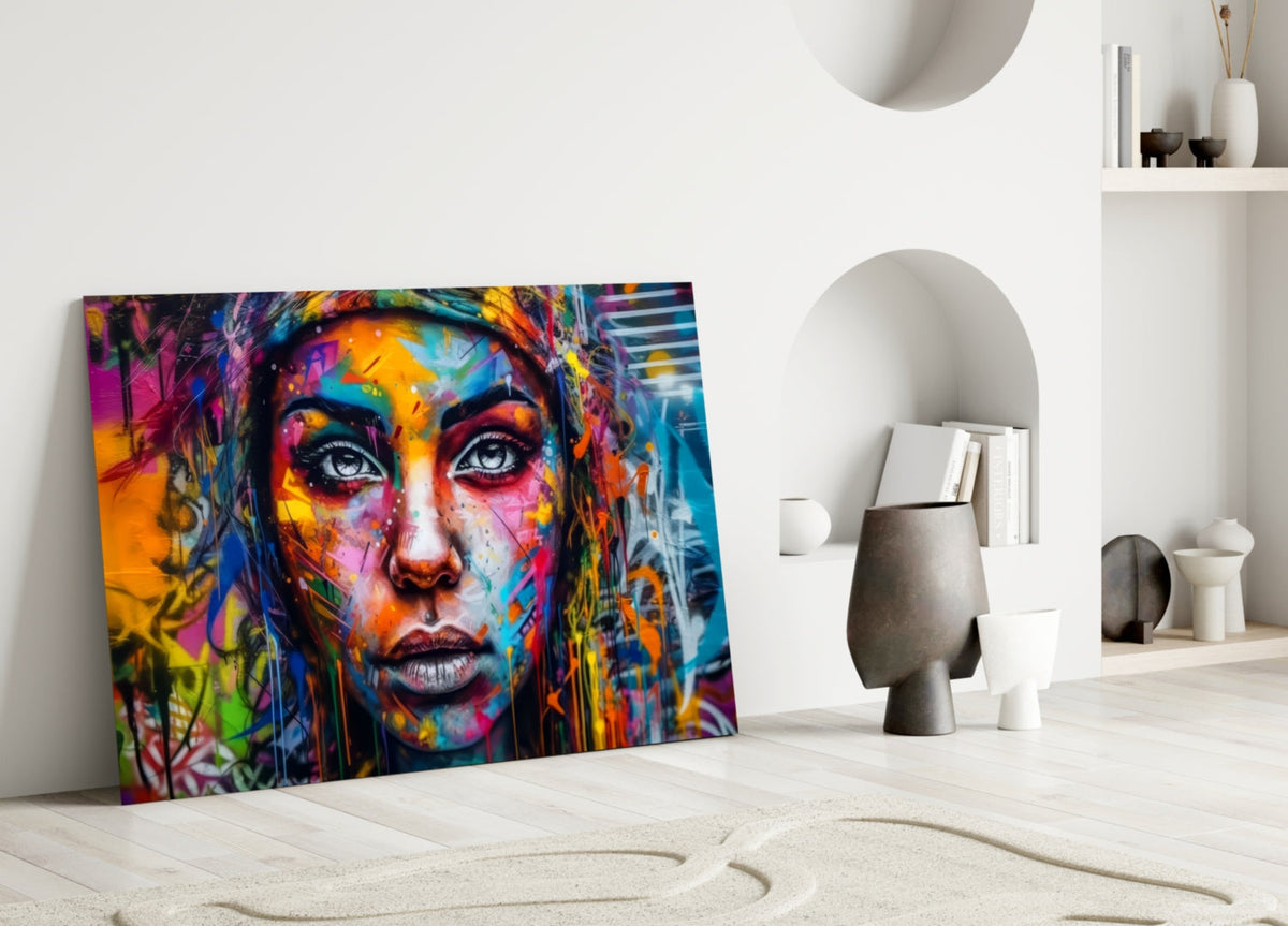 Wide eyed woman glass wall art leaning on the floor beside arched white shelves