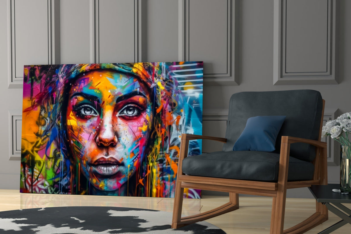 Graffiti portrait glass print above a blue armchair by a gray paneled wall