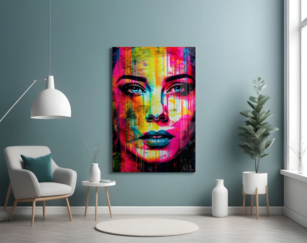 Neon drip portrait woman glass wall art on a pale blue wall above a white armchair and a potted tree