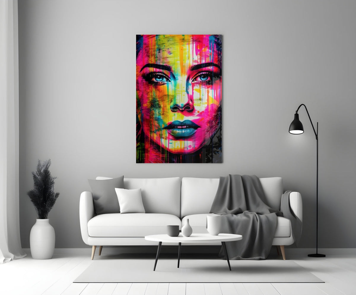 Neon drip portrait woman glass wall art above a white sofa in a gray living room with a black floor lamp