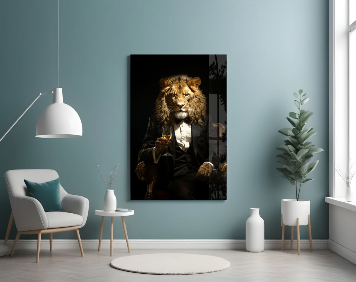 Tuxedo lion glass art on a blue-gray wall above a white armchair and a potted plant