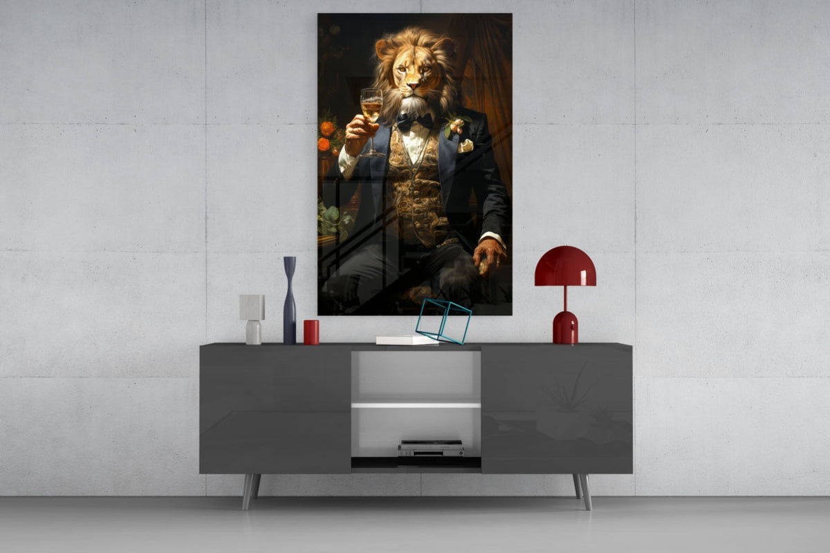 Lion in a navy tuxedo glass wall art above a gray sideboard with a red lamp