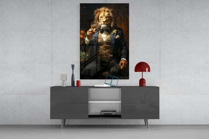 Lion in a navy tuxedo glass wall art above a gray sideboard with a red lamp