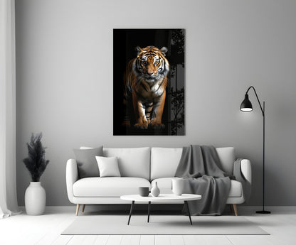 Stalking tiger on black glass wall art above a white sofa beside a black floor lamp