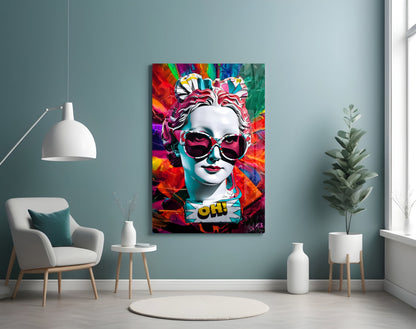 White bust in sunglasses glass wall art on a blue-gray wall above a white armchair and pendant lamp